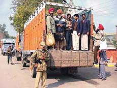 Polling staff leave for duty in Ludhiana on Tuesday.