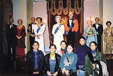 Students pose for a photograph at Madam Tussaud�s Wax Museum in London.