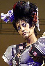 An Indian model displays a dress