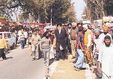 The SAD-BJP candidate from the Banur Assembly constituency and the Finance Minister of Punjab, Capt Kanwaljit Singh, being chased by a mob at Lalru on Wednesday.