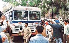 Congress workers block the traffic on the Chandigarh-Ambala highway on Wednesday in protest against the alleged rigging by Shiromani Akali Dal candidate Capt Kanwaljit Singh at a Lalru polling station.