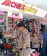 Police personnel in Bhopal guard the Archies Gallery 