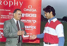 Gopalratnam Kannan, deputy general manager, the Swatch Group of India, presenting the best player award of the Swiss Polo Trophy, held at the Jaipur Polo Ground.