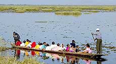 Voters travel by boat