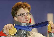 Simon Ammann of Switzerland shows off his two Olympic gold medals 