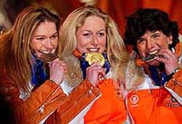 Olympic women's singles luge champion Sylke Otto (C), silver medallist Barbara Niedernhuber (R) and bronze medallist Silke Kraushaar