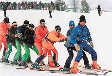 Winter sports lovers perform during the concluding ceremony