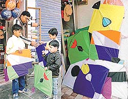 Children buying colourful kites to fly on the day of Basant.