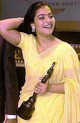 Popular actress Kajol holds the Filmfare Best Actress Award 