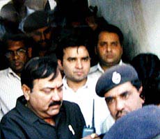 Aftab Ansari, (centre in white shirt) mastermind of the American Centre shootout