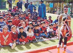 Children of Strawberry Fields enjoy a puppet show 