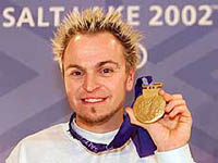 Steven Bradbury of Australia holds his gold medal from the men's Salt Lake 2002 Winter Olympic Games men's 1000m short track competition following a press conference in Salt Lake City on Sunday.