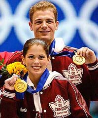 Canadian pair figure skaters David Pelletier (top) and Jamie Sale stand with their gold medals for their performance nearly a week earlier in which rival Russians, Yelena Berezhneya and Anton Sikharulidze, were awarded the gold in a controversial judging decision on Sunday.