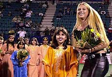 Russian tennis player Anna Kournikova receives flowers 