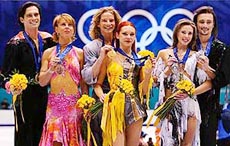 Medallists celebrate on the podium after the ice dancing free dance competition for the Salt Lake 2002 Olympic Winter Games, on Monday. 