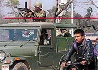 Nepalese army soldiers patrol in Katmandu on Tuesday.