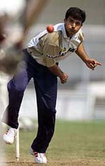 India�s captain Saurav Ganguly bowls to a teammate during a practice session