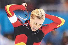 Speed skater Anni Friesinger of Germany celebrates her new world record