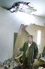 A Palestinian inspects the damage after an Israeli helicopter gunship fired missiles at a security office in the West Bank city of Ramallah on Thursday.