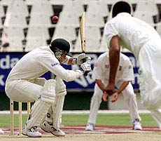 Australian opening batsman Justin Langer ducks