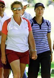 Tennis star Martina Hingis and her mother Melanie Molitor walk towards the 10th Green