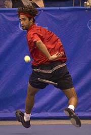 James Blake returns a shot