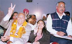 Mr Surinder Singla of the Congress and his daughter acknowledge the greetings of his supporters after winning from the Bathinda constituency on Sunday.