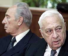Israeli Prime Minister Ariel Sharon (R) and Foreign Minister Shimon Peres 