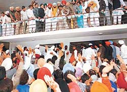 Supporters of Capt Amarinder Singh wave to welcome his election as leader of the Punjab Congress Legislative Party at Congress Bhavan in Chandigarh on Tuesday.
