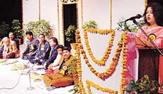 Sneh Mirchandani recites a poem at kavi sammelan organised by the Chandigarh Bank Town Office Language Implementation Committee at Tagore Theatre in Chandigarh on Wednesday.
