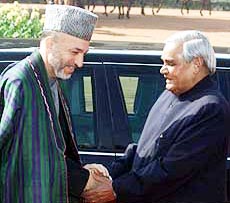 Prime Minister Atal Behari Vajpayee greets Afghan interim head Hamid Karzai