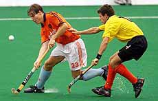 Rob Derikx of the Netherlands keeps the ball away