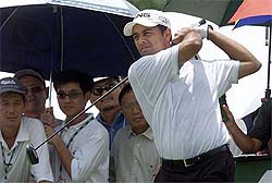 Arjun Atwal tees of during round one of the Malaysian Open golf tournament