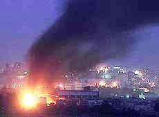 Smoke rises over the West Bank city of Beit Jala during a gunbattle between Palestinian gunmen and Israeli troops 