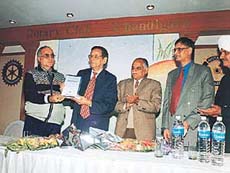 Prof K.N. Pathak, Vice-Chancellor of Panjab University, releases a book �Practical Aspects of Service Law� by H.C. Arora, in the Rotary Club, Sector 18, Chandigarh, on Saturday.