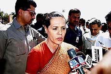 Congress President Sonia Gandhi talks to mediapersons
