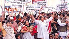 The activists of Delhi Pradesh Congress Committee protesting against communalism at Rajghat in the Capital on Saturday.