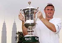 Scotland's Alastair Forsyth poses with Malaysian Open trophy