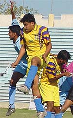 Players from UP Police (blue) and Jorba Durga from Orissa (yellow) in action during the 2nd Division National Football League at the Ambedkar Stadium in the Capital on Monday.