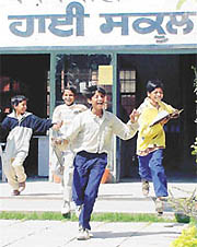 With sparkle in their eyes, slum kids come out of the examination centre at Government High School, Sector 24, Chandigarh, on Tuesday.