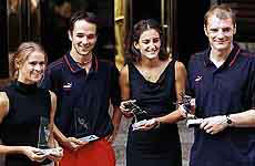 Hockey players, from left, Australia's Angie Serving, German's Tibor Weissenborn, Argentina's Luciana Aymar and Germany's Florian Kunz pose with their trophies in Kuala Lumpur 