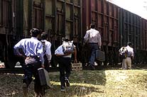 Students of Ayodhya try to catch a goods train