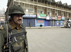 A BSF jawan guards a desert street