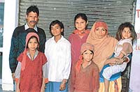 Khem Chand and his family, after having been freed from the captivity of a brick-kiln owner. 