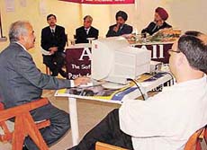 Dr O.P. Sharma (extreme left) gives presentation on IT and medicine at a seminar organised by the IMA, Chandigarh, on Sunday.