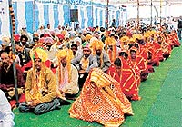 Bridegrooms and brides at a mass marriage ceremony organised by the Nishkaam Seva Ashram at Daad on Sunday.