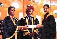 The Principal of J.L.N. Government College for Women, Mandi Gobindgarh, Ms Amar Shoba, presents a degree to a student at the annual day function of the college on Saturday. Dr Tarlok Singh Anand, Dean, Academic Affairs, Punjabi University, Patiala, is also seen in the picture.