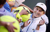 Monica Seles signs autographs after defeating Martina Sucha, of Slovakia.