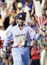 Indian cricket captain Saurav Ganguly acknowledges the crowd upon completing his half century during the second one-day game against Zimbabwe in Mohali on Sunday.