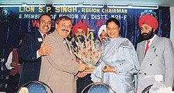 Multiple Council Chairman N.K. Grover, District Governor D.K. Sood and Region Chairman S.P. Singh honour Ms Lakhwinder Garcha on her appointment as OSD to CM, Punjab, at Lions Region conference held at Kharar.
